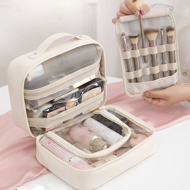 Cosmetic bag with transparent compartments
